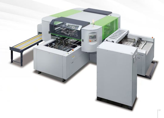 Large industrial automatic hardcover making machine with green and grey panels, showing feeding and output trays.