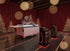 JDS800 automatic double-sided applicator in a festive showroom with red curtains and Christmas trees